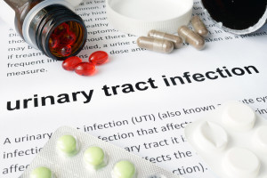 Paper with urinary tract infection and pills.