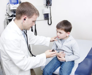 doctor helping a child during a pediatric emergency